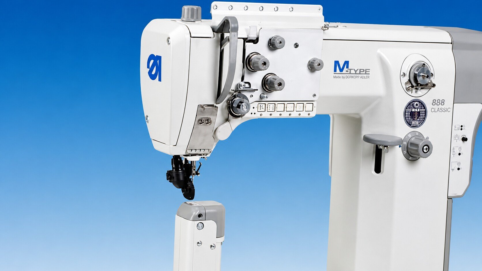 Durkopp Adler M-TYPE 888 CLASSIC post bed sewing machine head against a blue background