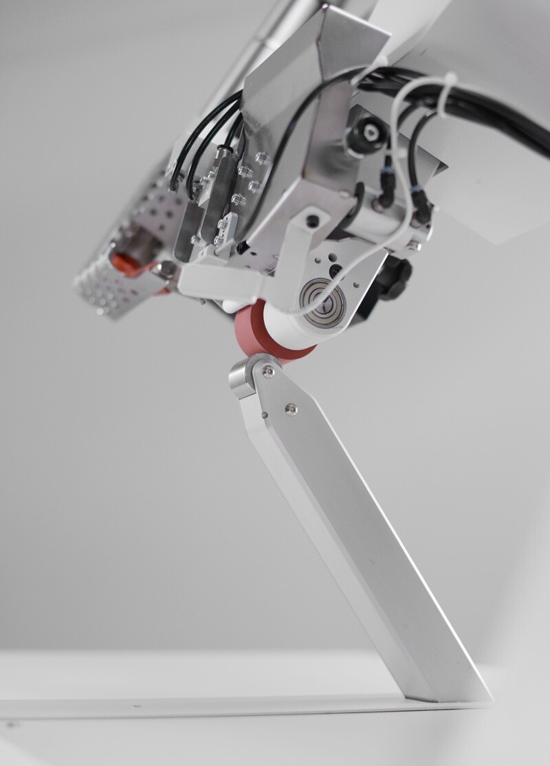 Close-up of the PFAFF 8303i taping head on its narrow post